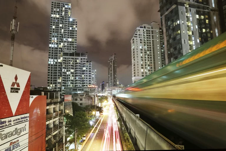 Night cityscape with train and traffic light trails created by a long shutter speed.