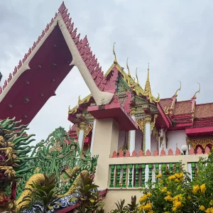 dragon gate wat suwan khirri wong temple entrance with ornate roofline and sculpture