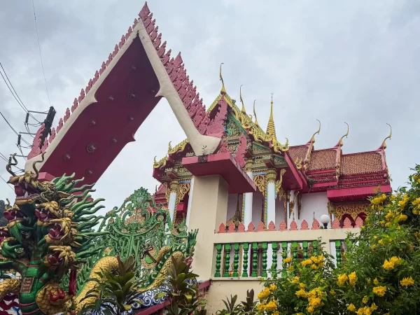 dragon gate wat suwan khirri wong temple entrance with ornate roofline and sculpture