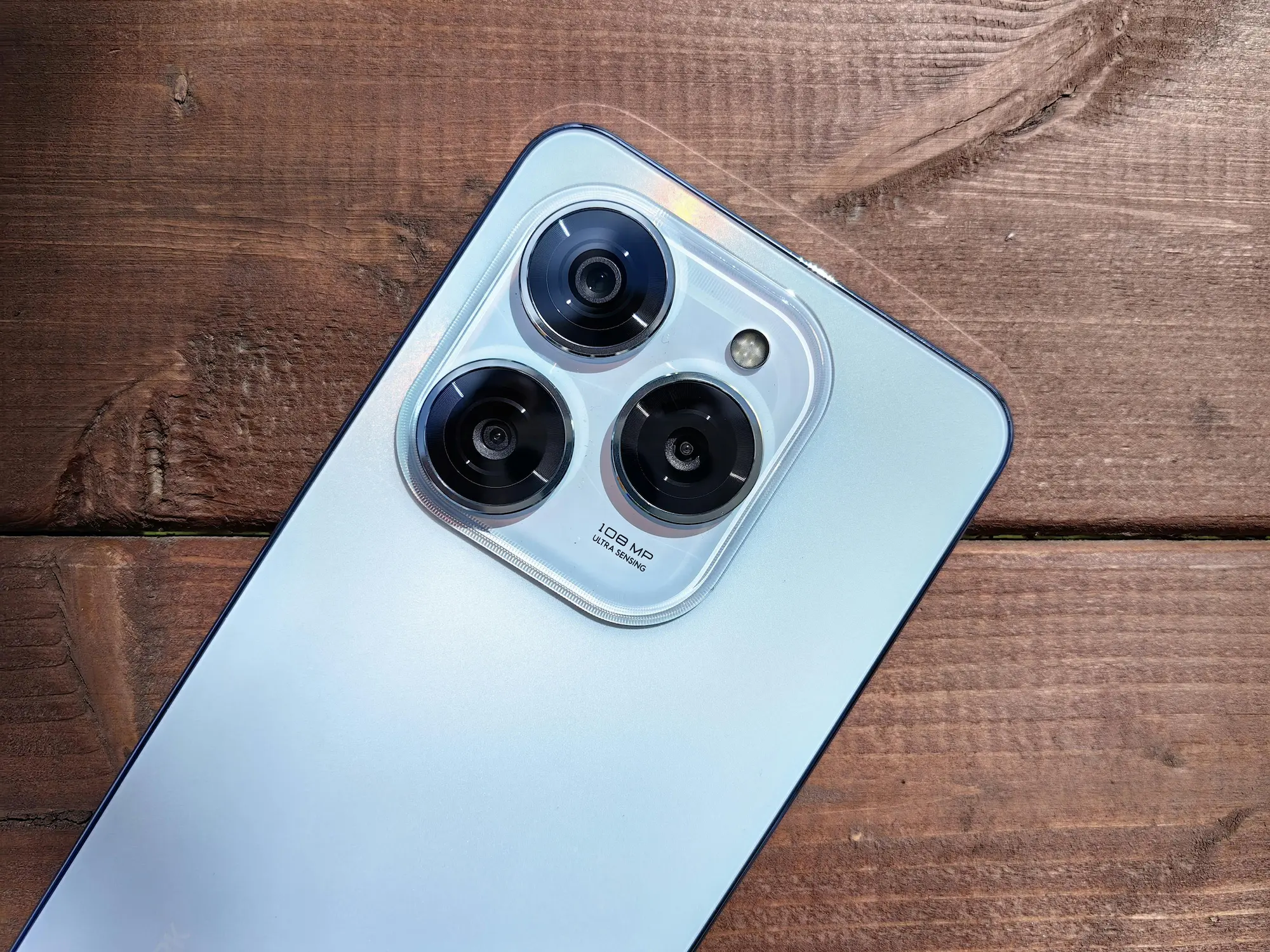 Close-up view showing how phone cameras work using multiple camera lenses
