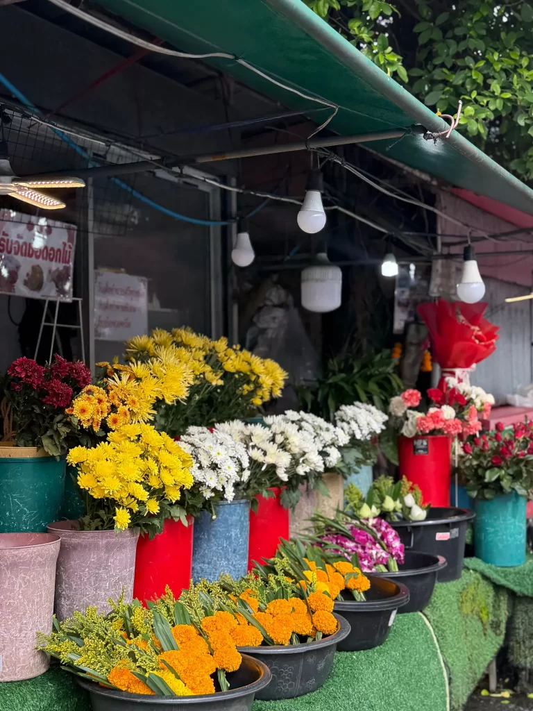 Unclear photo of a flower stall where the scene includes many competing elements, so the subject isn’t obvious.