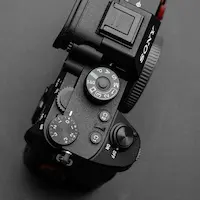 Close-up of a Sony camera on grey background – real creator gear