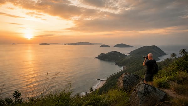Reflections Photography practical photography lesson showing a documentary-style photographer capturing a coastal scene in Thailand during soft tropical golden-hour light
