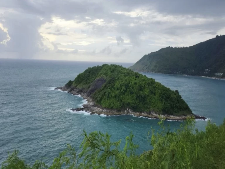 Tropical island viewed from an elevated coastal viewpoint illustrating storytelling in photography and the difference between scenery and narrative.